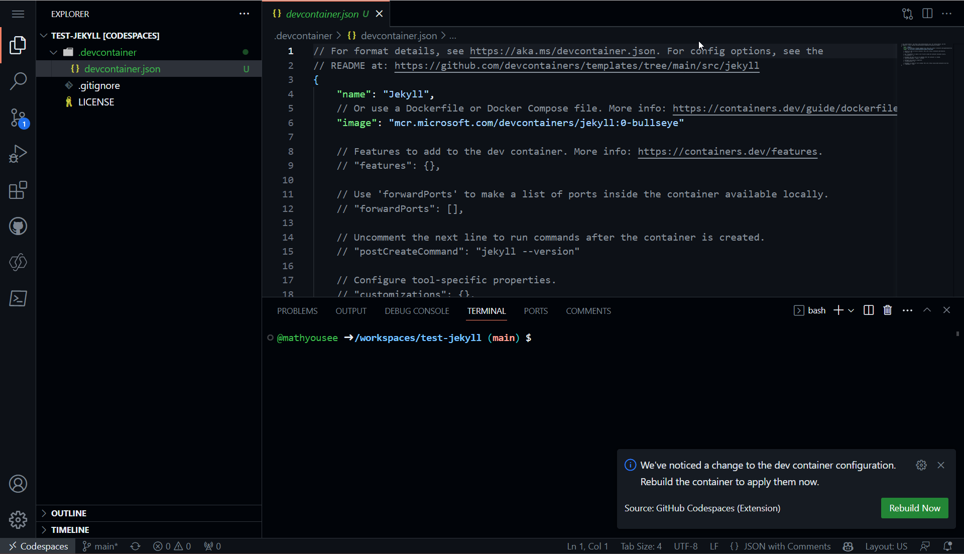 The container definition with a toast notification to rebuild the codespace